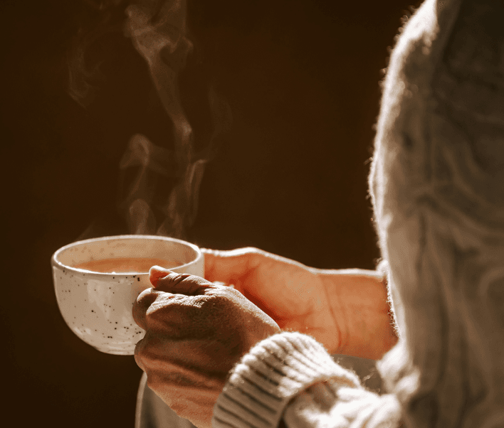 woman with a cozy cup of tea